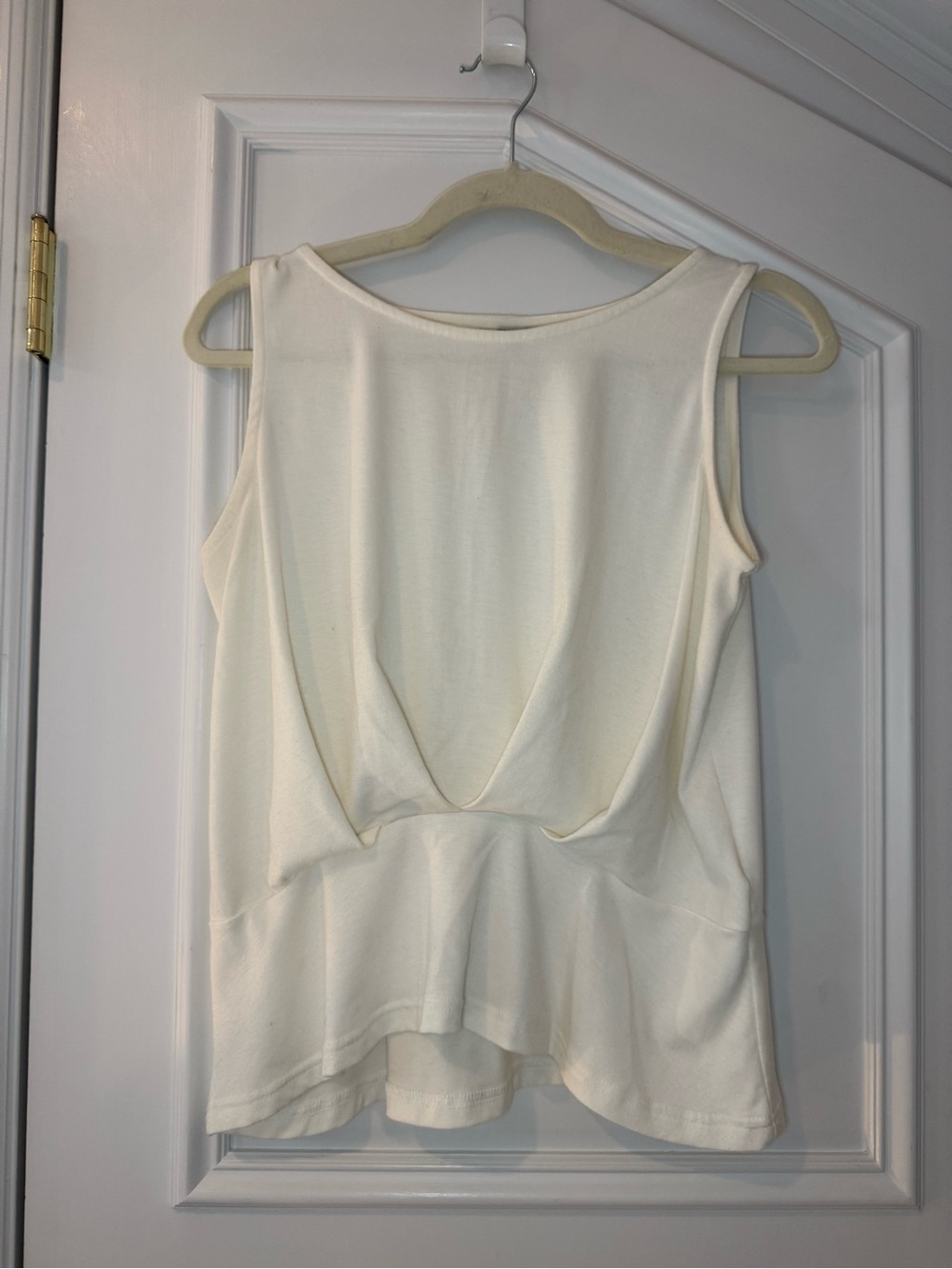 Roomy’s Ivory Open Back Draped Peplum Tank Top